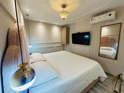 Cama o camas de una habitación en Hotel Paris Carré