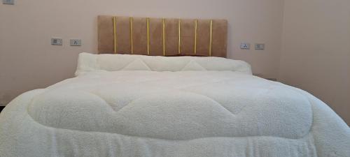 Ένα ή περισσότερα κρεβάτια σε δωμάτιο στο HATENA Guest House