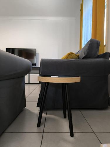 a couch and a table in a living room at Fonte da Rosa Guest House APT1 in Belmonte