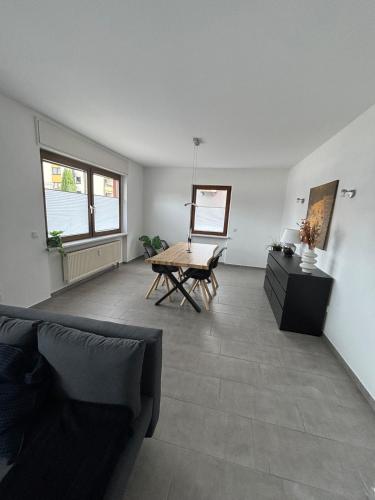 a living room with a couch and a table at Ferienwohnung in Kenn in Kenn