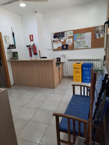 a waiting room with a counter in a store at Albergue Albas EXCLUSIVO para Peregrinos in Logroño
