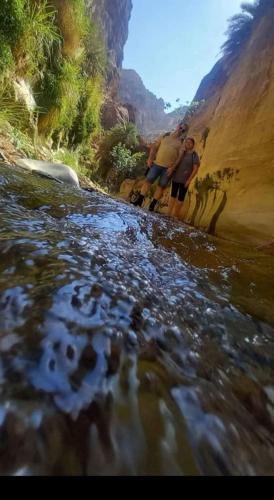 two men standing on the side of a river at Dana's scenic trails in Dana