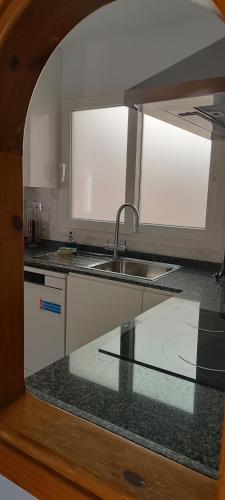 a kitchen with a sink and a counter top at Casa Doris in Los Alcázares