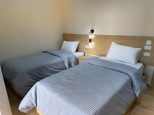 Ένα ή περισσότερα κρεβάτια σε δωμάτιο στο Landmark Hostel Cairo