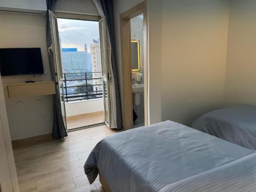 Ένα ή περισσότερα κρεβάτια σε δωμάτιο στο Landmark Hostel Cairo