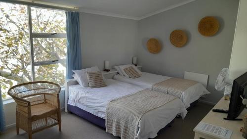 Ένα ή περισσότερα κρεβάτια σε δωμάτιο στο Brightwater Lodge