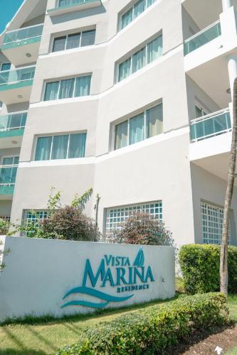 a sign in front of the west marina hotel at Vista Marina Residence in Boca Chica