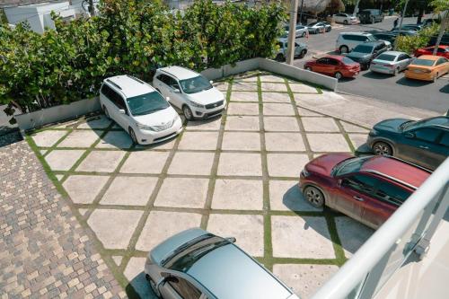 a group of cars parked in a parking lot at Vista Marina Residence in Boca Chica