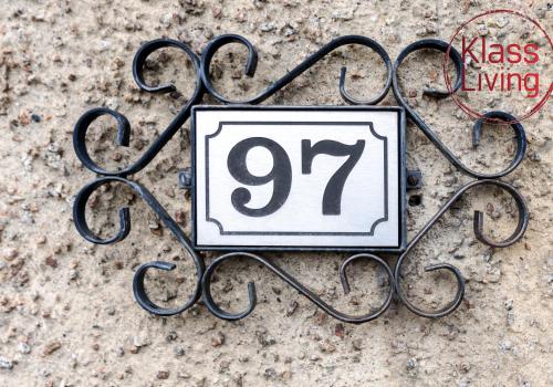 a sign with the hanging on the ground at Aitkenhead house by Klass Living in Coatbridge