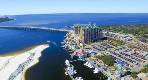 an aerial view of a hotel and a marina with boats at Cool Azul 3 Community Pools Central Destin in Destin