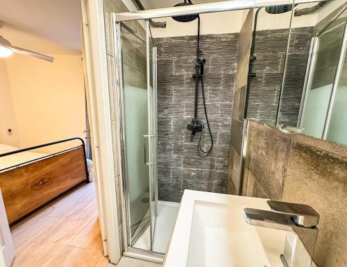 a bathroom with a shower and a sink at Charming Flat in the Historic Center of Saint-Rémy in Saint-Rémy-de-Provence