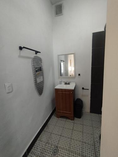 a bathroom with a sink and a mirror at DGM Lofts MTY MN 960 E centro cerca de todo in Monterrey