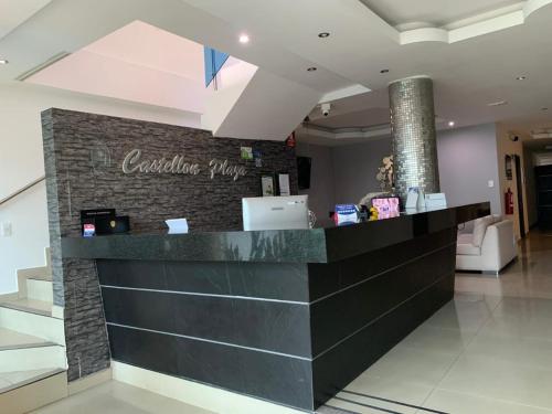 a cashier counter in a lobby of a store at Hotel Castellon Plaza Pereira in Pereira