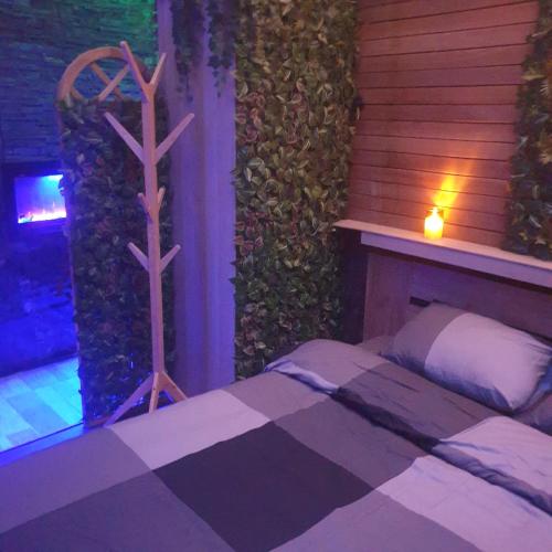 a bedroom with a bed with a cross on the wall at Majestic Wellness Center in Brussels