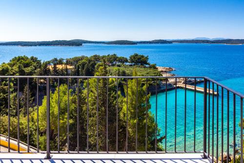 a balcony with a view of the water at Blue Bay Residence in Hvar