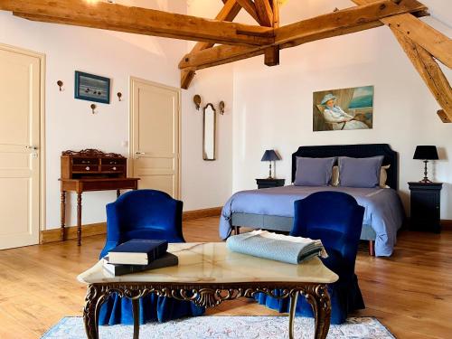 Ένα ή περισσότερα κρεβάτια σε δωμάτιο στο Maison Adrienne