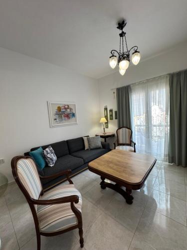 a living room with a couch and a table at MELMEt18 in Agios Nikolaos