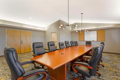 a conference room with a long wooden table and chairs at Best Western Plus Grant Creek Inn in Missoula