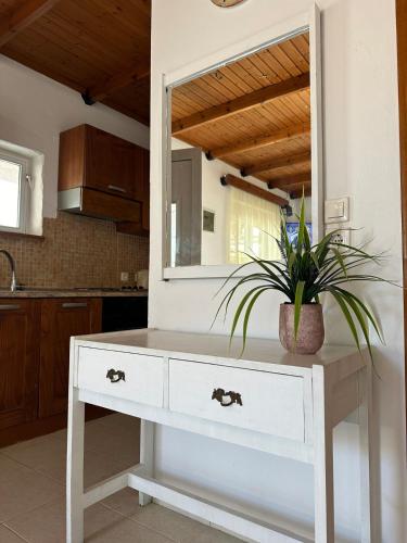 a white dresser in a kitchen with a mirror at Levante Apartment for 4 in Faliraki