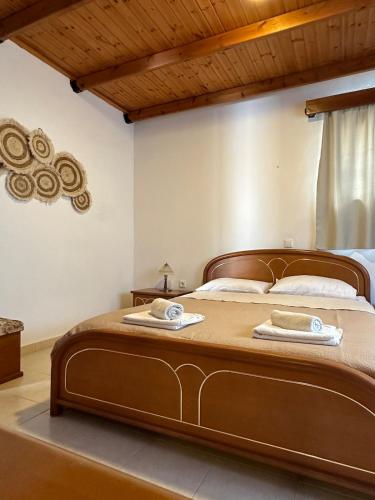a bedroom with a bed with two towels on it at Levante Apartment for 4 in Faliraki