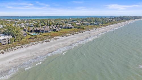 an aerial view of a beach with houses and the ocean at Beach Blessings in Longboat Key