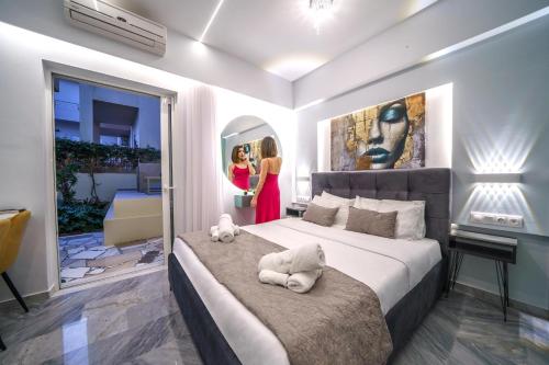 Postel nebo postele na pokoji v ubytování Amelia luxury Suites