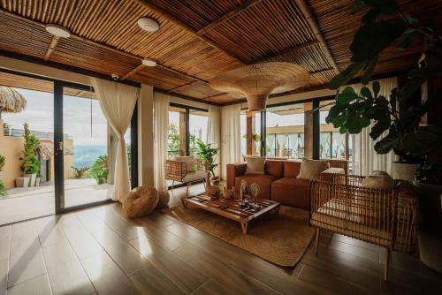 a living room with a couch and a table at Casa Malva Villas in Buenavista