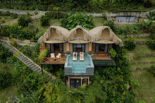 an aerial view of a house with a straw roof at Casa Malva Villas in Buenavista