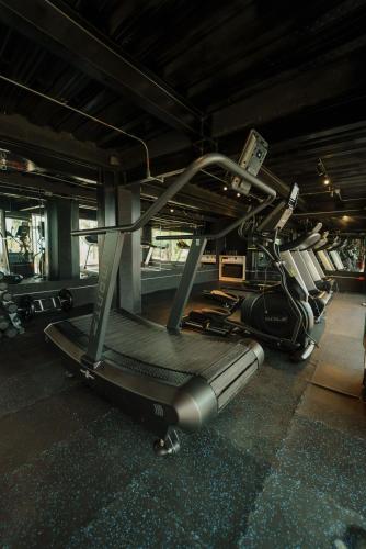 a gym with several cardio machines in a room at Casa Malva Villas in Buenavista