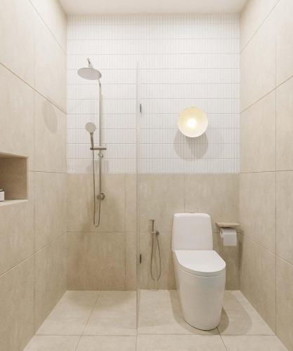 a bathroom with a shower with a toilet in it at 68 Hotel Go Cong in Gò Công
