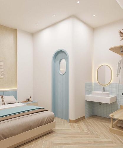 a bedroom with a bed and a sink at 68 Hotel Go Cong in Gò Công