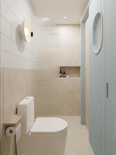 a bathroom with a white toilet and a tub at 68 Hotel Go Cong in Gò Công