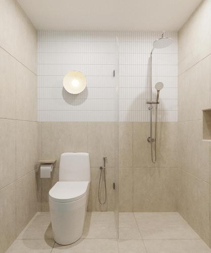 a bathroom with a toilet and a shower at 68 Hotel Go Cong in Gò Công