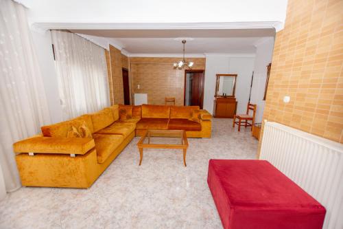 a living room with a couch and a table at Siagito Apartment in Stavros