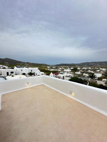a view of the city from the roof of a house at Myconian Villa -7 min Chora - center - 130sqm - 4people - 2 rooms - Secured Free Parking,- Elenas Hospitality - in Mýkonos City