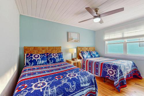 Ένα ή περισσότερα κρεβάτια σε δωμάτιο στο Sun Haven