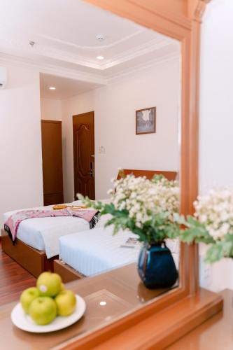 DAHLIALAND SAIGON HOTEL & SWIMMING PooLにあるベッド