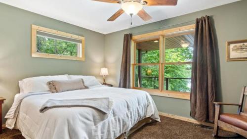 a bedroom with a bed and a window at 5 Pines on Ossie by Woods to Water in Breezy Point