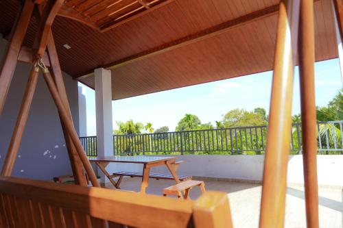 a screened in porch with a table and chairs at Spacious Eco Guest House Colombo in Sri Jayewardenepura Kotte