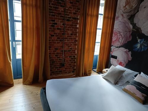 Postel nebo postele na pokoji v ubytování 13 suites