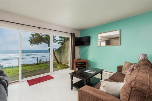 a living room with a view of the ocean at Ocean Terrace Condominiums in Lincoln City