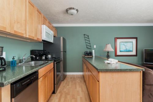 a kitchen with a sink and a counter top at Ocean Terrace Condominiums in Lincoln City