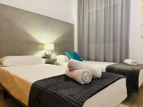Ένα ή περισσότερα κρεβάτια σε δωμάτιο στο Golf and Sea Oasis