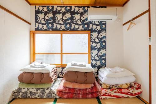 a room with three bean bags in front of a window at Guesthouse & Kitchen Hace - Vacation STAY 75344v in Iwaki