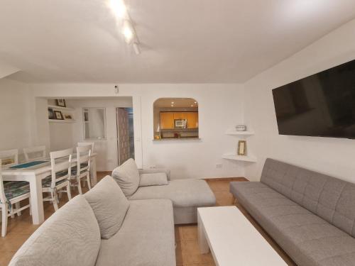 a living room with a couch and a table at Casa en Marbella Centro con encanto in Marbella