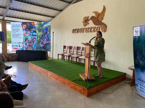 a woman standing at a podium with a microphone at Eco Arazzá in Mera