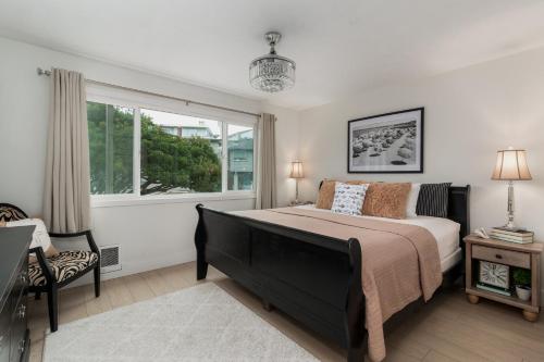 a bedroom with a large bed and a window at Ocean Terrace Condominiums in Lincoln City