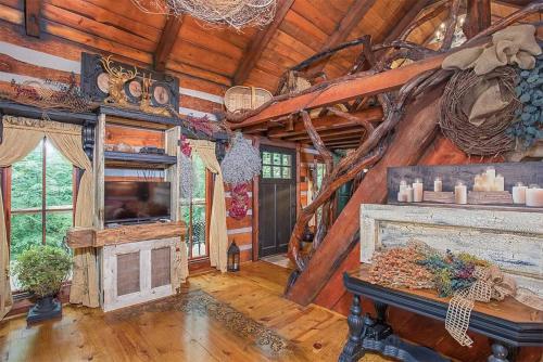 a living room with a fireplace and a wooden ceiling at A Mammoth Cave Getaway in Park City