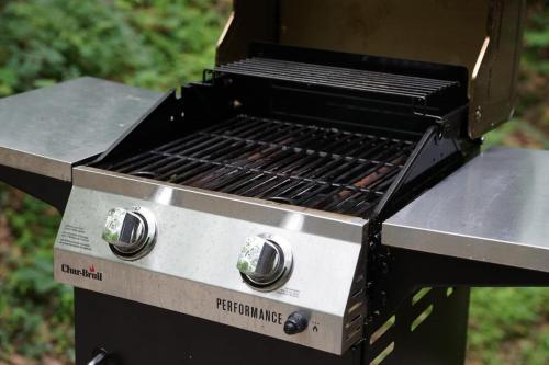 a barbecue grill sitting on top of a field at A Mammoth Cave Getaway in Park City