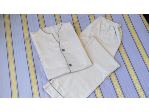a pair of white clothing sitting on a bed at Hotel Koza - Vacation STAY 84847v in Okinawa City